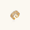 Gold and silver open ring on a white background
