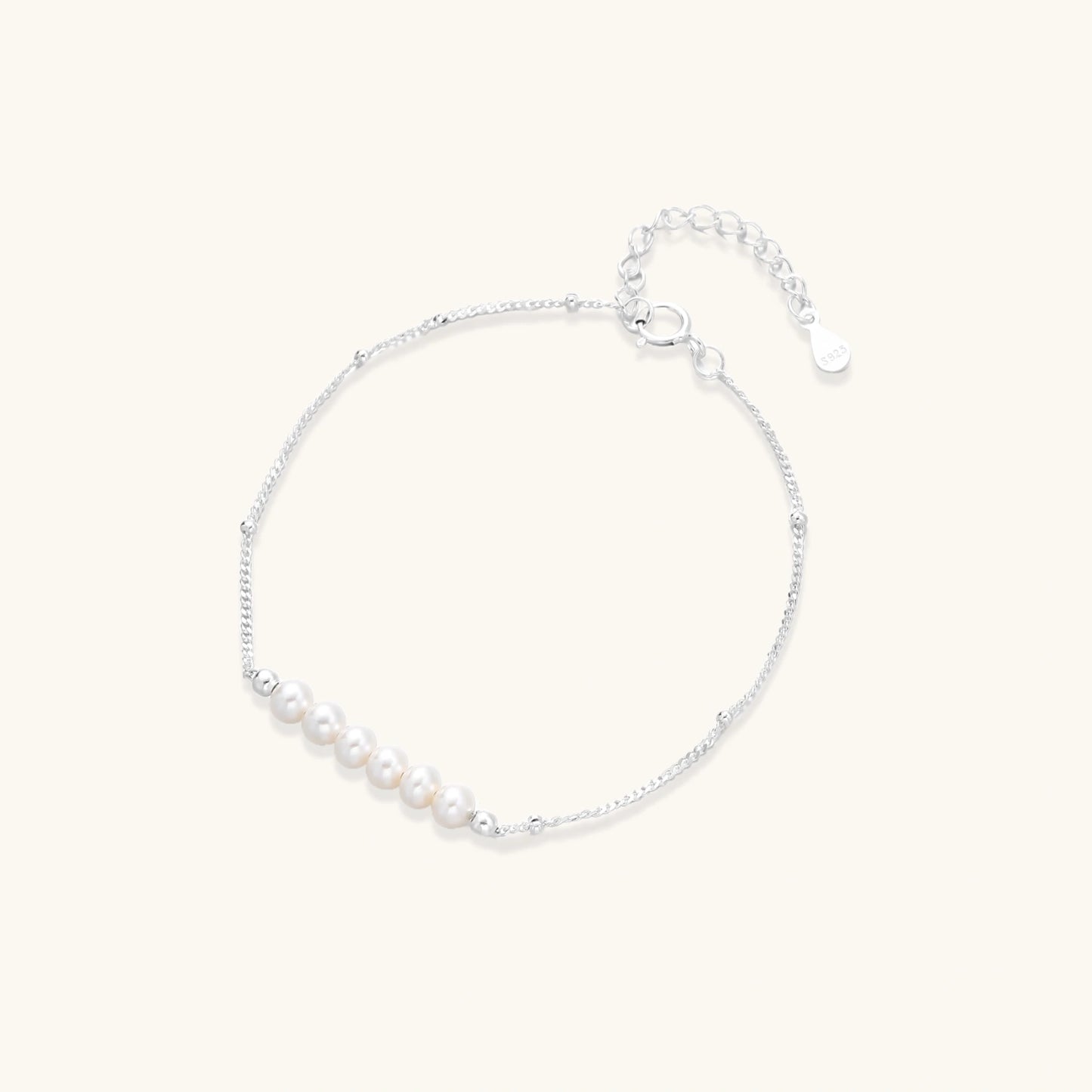 Delicate rhodium-plated silver chain bracelet with row of small baroque pearls 