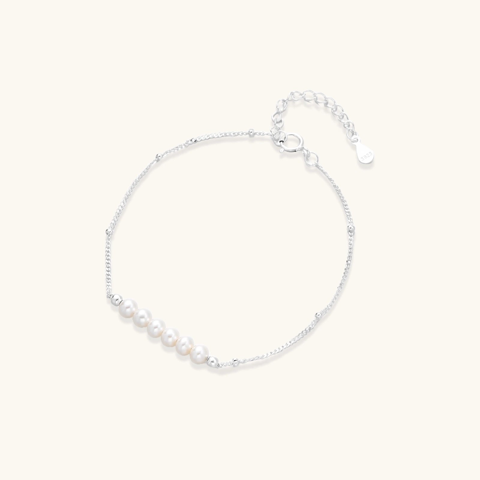 Delicate rhodium-plated silver chain bracelet with row of small baroque pearls 